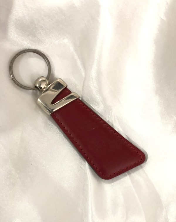 Maroon Z-Accent Leather Keychain by J's Store with a bold color and unique metallic detail.