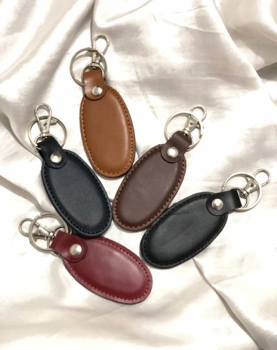 Simple Leather Keychain in five colors by J's Store, showcasing sleek and durable designs.