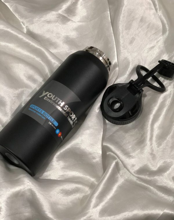 Close-up of the Youth Sports 18-Hour Insulated Sports Bottle from J's Store, highlighting the durable steel construction and leak-proof lid.