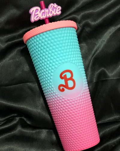 Barbie Glow-Up Tumbler in a gradient pink-to-blue textured design with a Barbie logo straw topper, exclusively from J's Store.