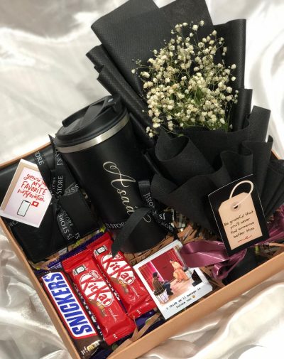 J's Store Eternal Love Gift Box: A romantic gift box featuring a personalized tumbler, wallet, chocolates, flowers, and polaroids. Shop gift box for him online in Pakistan.