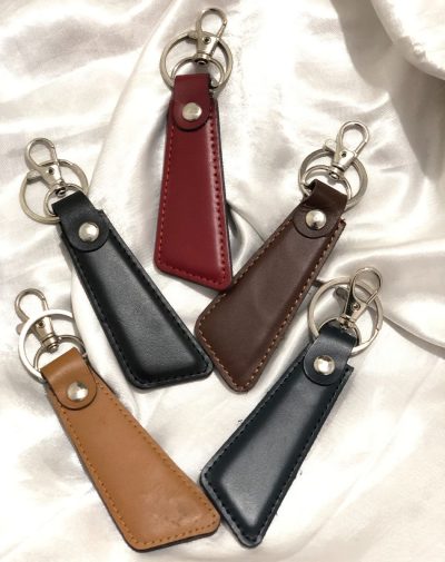 Sleek Leather Keychain by J's Store in five colors, showcasing a contemporary and minimalistic design.