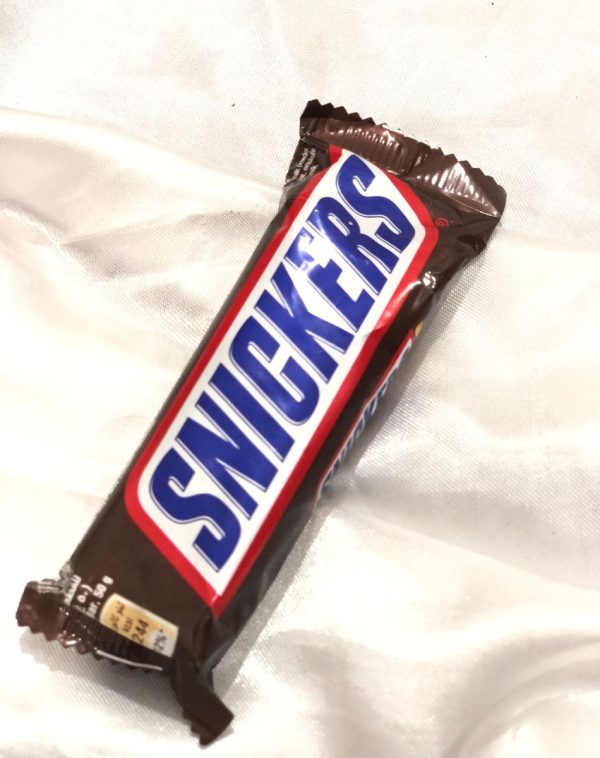 Snickers chocolate bar with peanuts, caramel, and nougat.