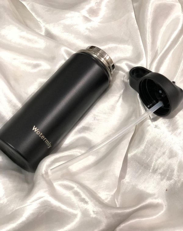 Black Watermly Hydrator Pal bottle with a straw lid, showcasing its convenient drinking option.