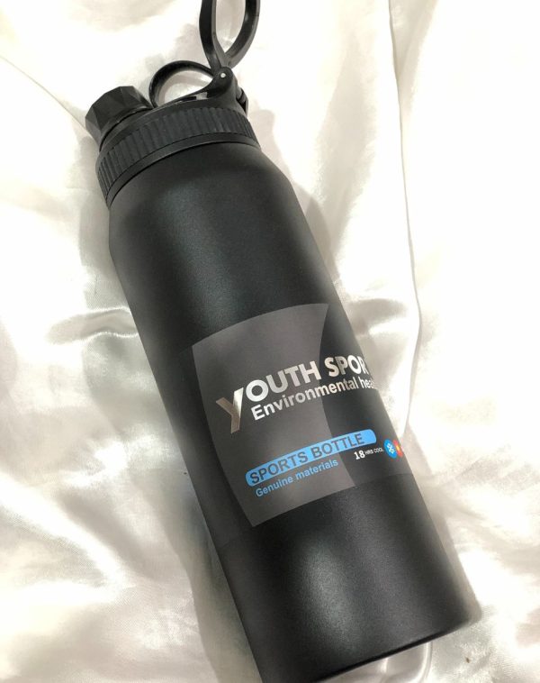 Front view of the Youth Sports 18-Hour Insulated Sports Bottle from J's Store, showcasing its sleek black design and convenient flip-top lid.