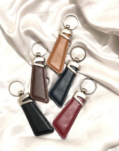 Z-Accent Leather Keychain by J's Store in five colors, featuring a distinctive metallic accent for added style.