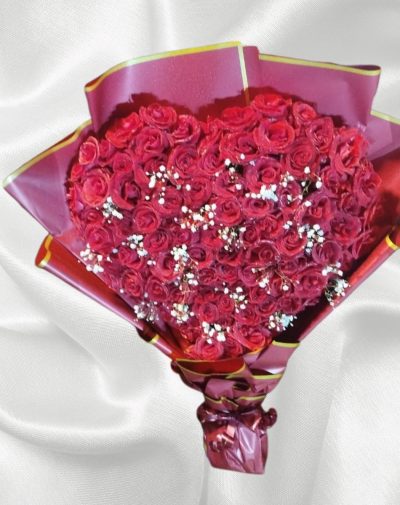100+ Red Rose Heart Bouquet – A luxurious heart-shaped bouquet of over 100 fresh red roses, wrapped elegantly in premium paper. Perfect for Valentine's Day and special occasions.