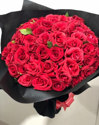 Fifty Shades of Love – A luxurious bouquet of 50 premium red roses wrapped in elegant black and red packaging.