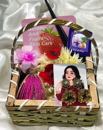 Radiant Bloom Ritual Basket from J’s Store with Mehndi Cone, Face Sheet Mask, Hair Claw Clip, Artificial Gajra, Bangles Set, and Jhumkay. A perfect Eid gift for her.