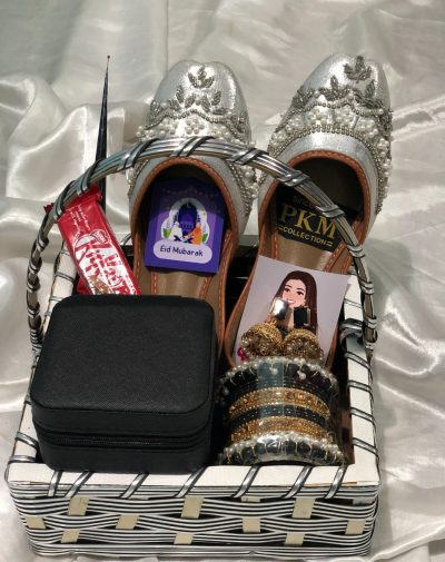 Dainty Diva's Delight Basket – Eid gift basket online in Pakistan featuring silver Khussa, a Bangles Set, Jhumkay, a Jewelry Organizer, a Mehndi Cone, and a KitKat. Perfect for wife, friend, mother, or daughter. Order from the USA, UK, UAE, Saudi Arabia, Canada, and Australia.