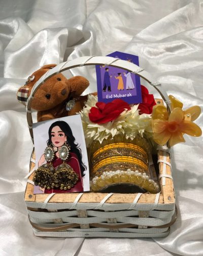 Moonstone Melody Basket from J’s Store with Jhumkay, Bangles Set, Hair Claw Clip, Artificial Gajras, and Teddy Bear Keychain, perfect for Eid gifting.
