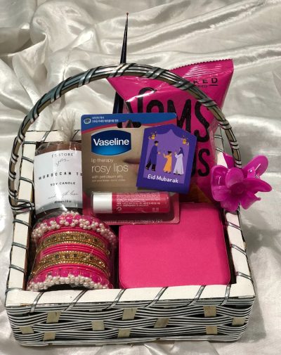 Spice & Sparkle Basket from J’s Store featuring a scented candle, mehndi cone, nachos, bangles set, lip balm, and jewelry organizer.
