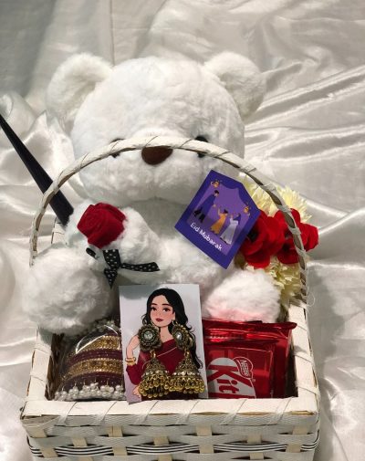 Teddy & Trinket Basket - A thoughtful Eid gift featuring a Teddy Bear, bangles, Jhumkay, mehndi cone, artificial gajre, and chocolates.