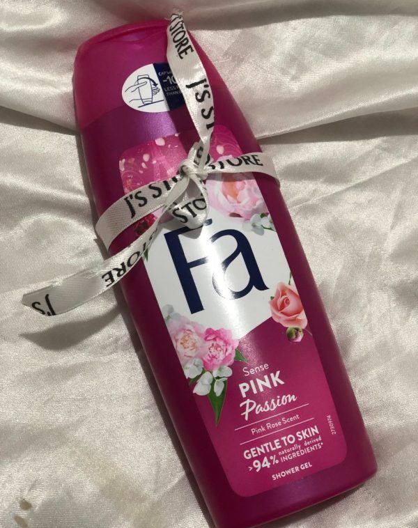 A vibrant pink bottle of Fa Shower Gel with a "Sense Pink Passion" label and a "Pink Rose Scent.