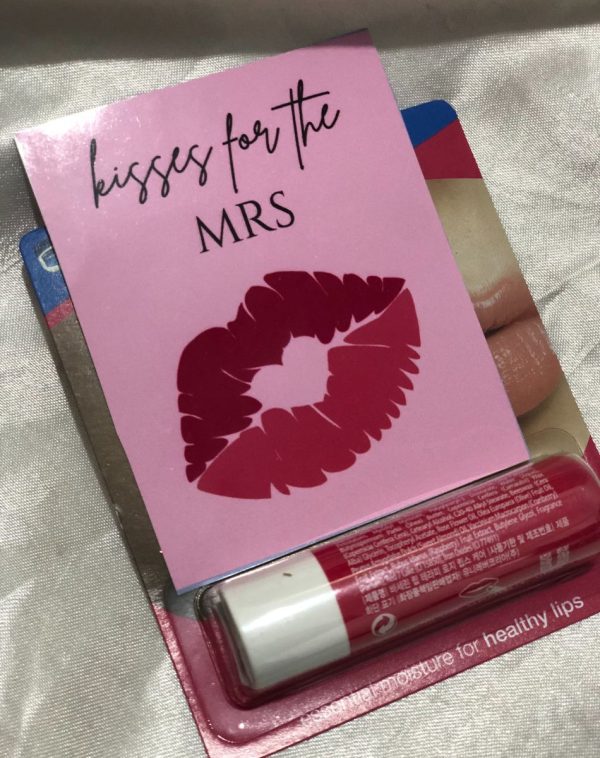 A tube of Vaseline brand lip balm in a "Red Cherry" flavor.