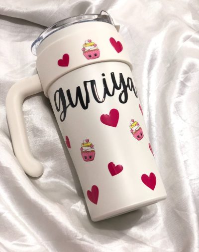 Customized Handle Sipper Tumbler in three colors (Pink, Blue, Gray) showcasing personalization and a large comfort handle.
