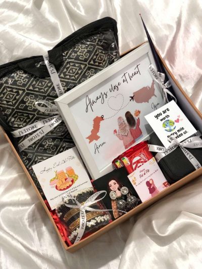 Miles Apart, Hearts Together Box is a premium Eid Gift Boxes For Her set from J’s Store featuring an Unstitched Suit and Jewelry.