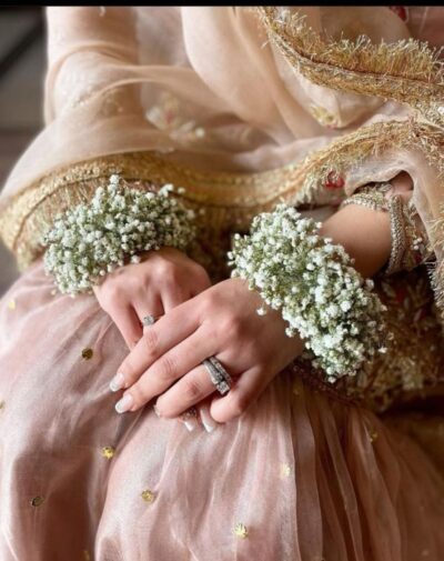 Baby Breath Floral Gajra set featuring fresh white gypsophila wrist bangles worn with a bridal outfit from J's Store