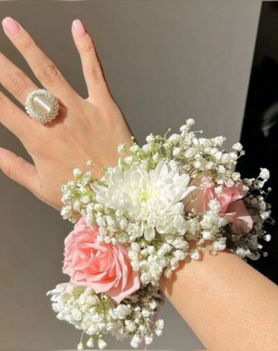 Dreamscape Floral Garland wrist accessory featuring pink roses white chrysanthemums and baby's breath from J's Store