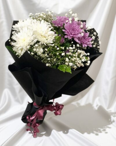 Lavender Frost Elegance fresh flower bouquet featuring purple and white chrysanthemums with baby's breath in black paper from J's Store
