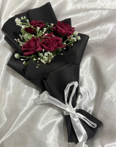 Midnight Velvet Artificial Bouquet featuring deep red velvet faux roses and white filler flowers in black wrapping from J's Store