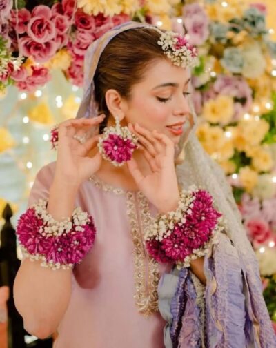 Signature Wedding Pieces fresh flower bridal jewelry set featuring magenta chrysanthemums gajras earrings and teeka from J's Store