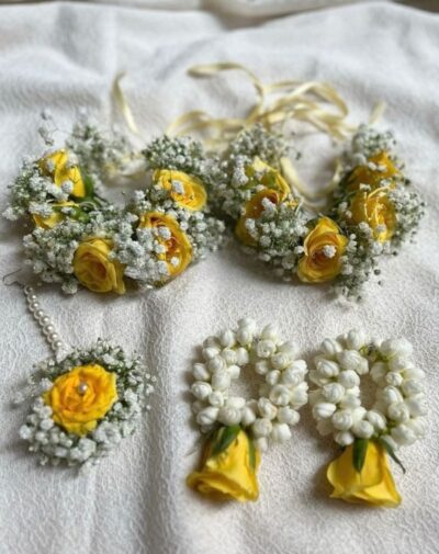 Sunny Bridal Set featuring yellow rose wrist gajras baby's breath maang tikka and jasmine earrings from J's Store