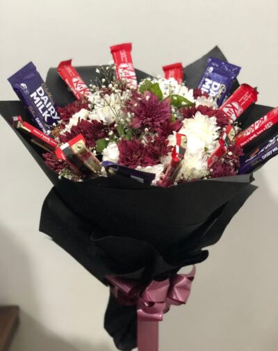 Sweet Confection Floral Harmony chocolate bouquet featuring Cadbury Dairy Milk KitKat maroon chrysanthemums and baby's breath from J's Store
