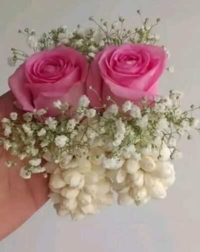 The Pastel Floral Gajra set featuring pastel pink roses jasmine buds and baby's breath from J's Store