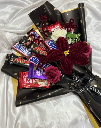 Velvet Blossoms Chocolate Bouquet with Snickers Mars KitKat Dairy Milk chocolates maroon velvet flowers and black gold wrapping from J's Store